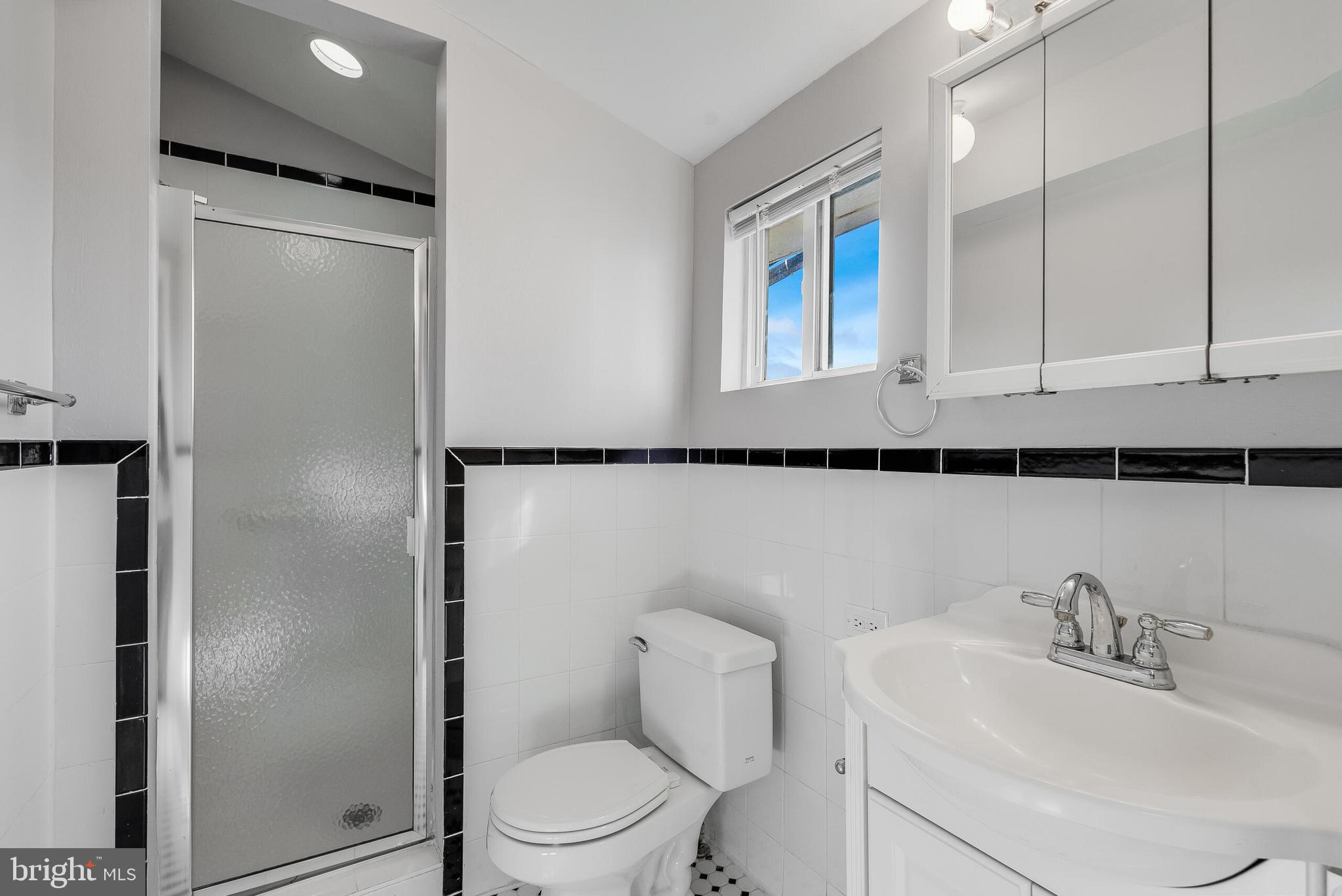 2116 North Capitol Street Northwest Washington, DC 20002 - Photo 50 of 50 a white toilet sitting next to a bathroom sink