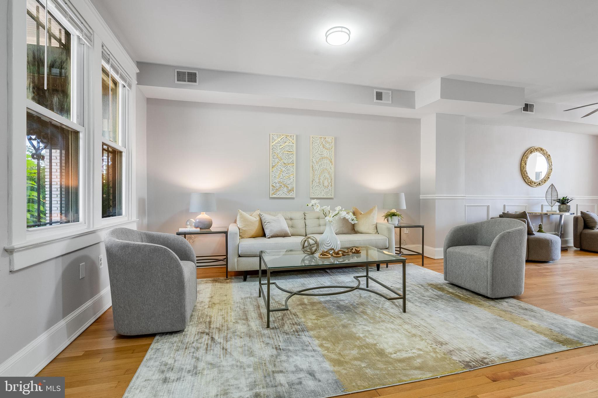2116 North Capitol Street Northwest Washington, DC 20002 - Photo 7 of 50 a living room with furniture and a large window