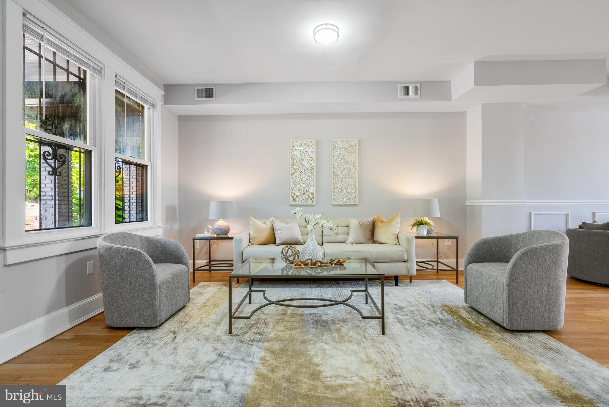 2116 North Capitol Street Northwest Washington, DC 20002 - Photo 8 of 50 a living room with furniture lamp and window