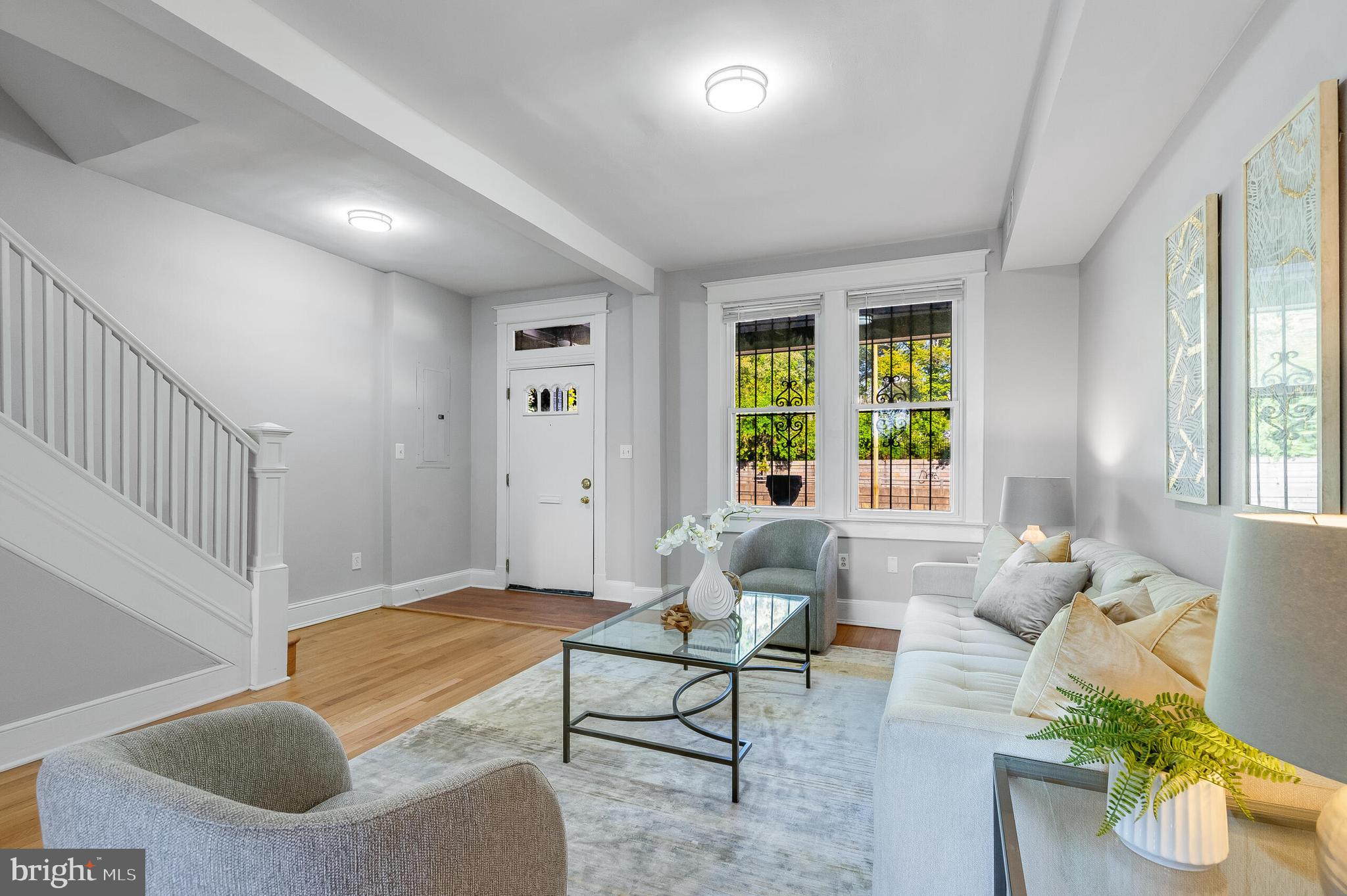 2116 North Capitol Street Northwest Washington, DC 20002 - Photo 10 of 50 a living room with furniture and a large window