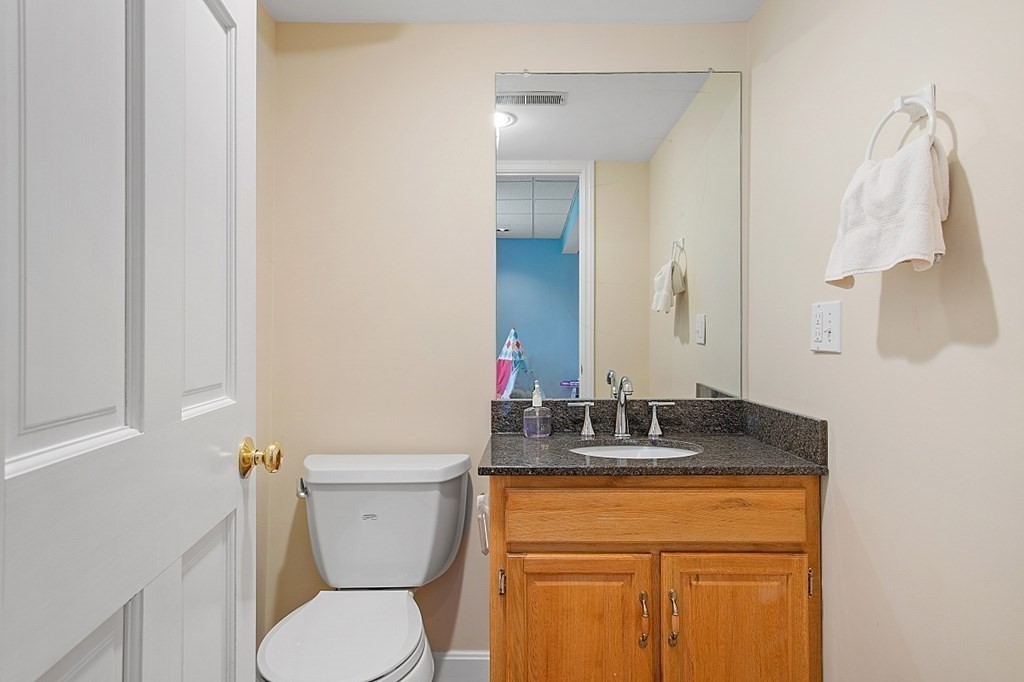 195 Lancaster Road North Andover, MA 01845 - Photo 33 of 42 a bathroom with a granite countertop sink toilet and mirror