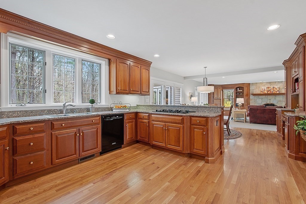 195 Lancaster Road North Andover, MA 01845 - Photo 5 of 42 a large kitchen with stainless steel appliances granite countertop a large window a sink and a counter space