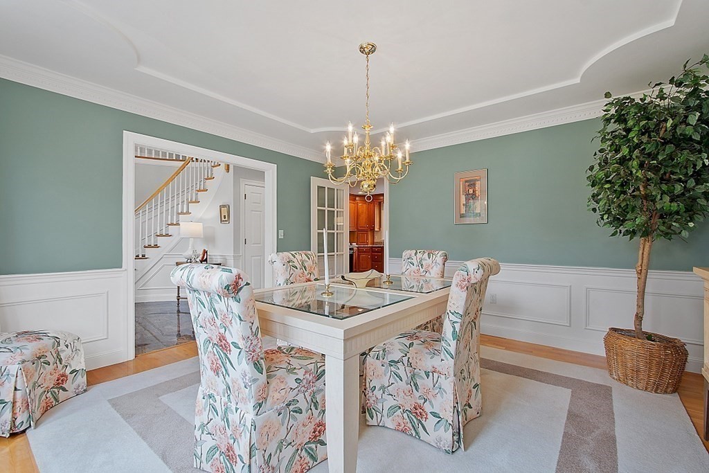 195 Lancaster Road North Andover, MA 01845 - Photo 8 of 42 a view of a dining room with furniture and chandelier