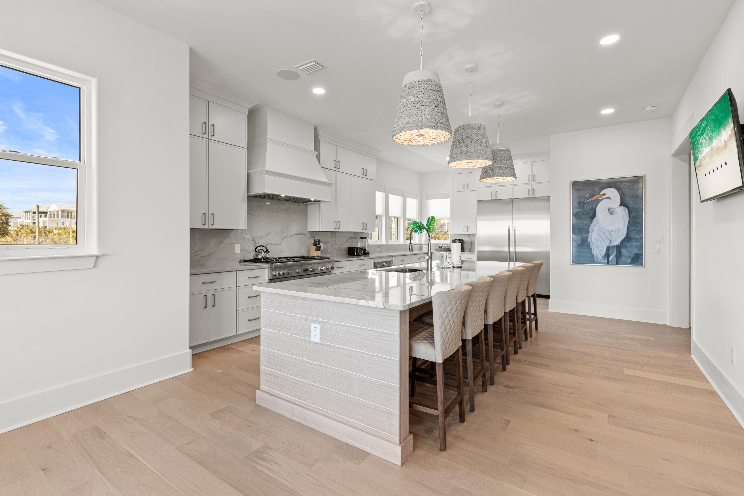 12 Jan Court Inlet Beach, FL 32461 - Photo 16 of 58 a kitchen with stainless steel appliances kitchen island granite countertop a lot of counter space and wooden floors