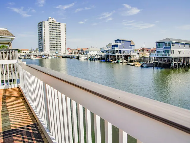 a view of a lake with tall buildings