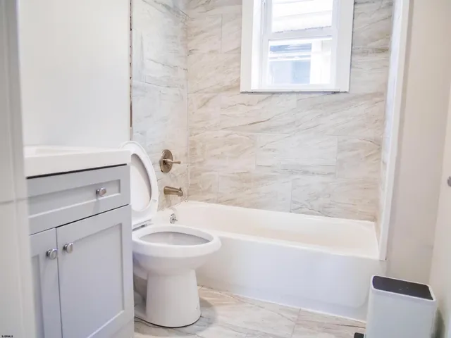 a bathroom with a sink and a bathtub