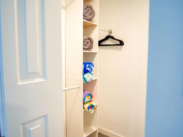 a bed room with a bed and a white wall