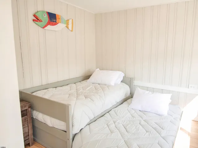 a living room with a window and a table