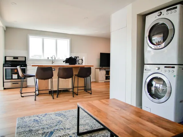 a view of a living room and dining room