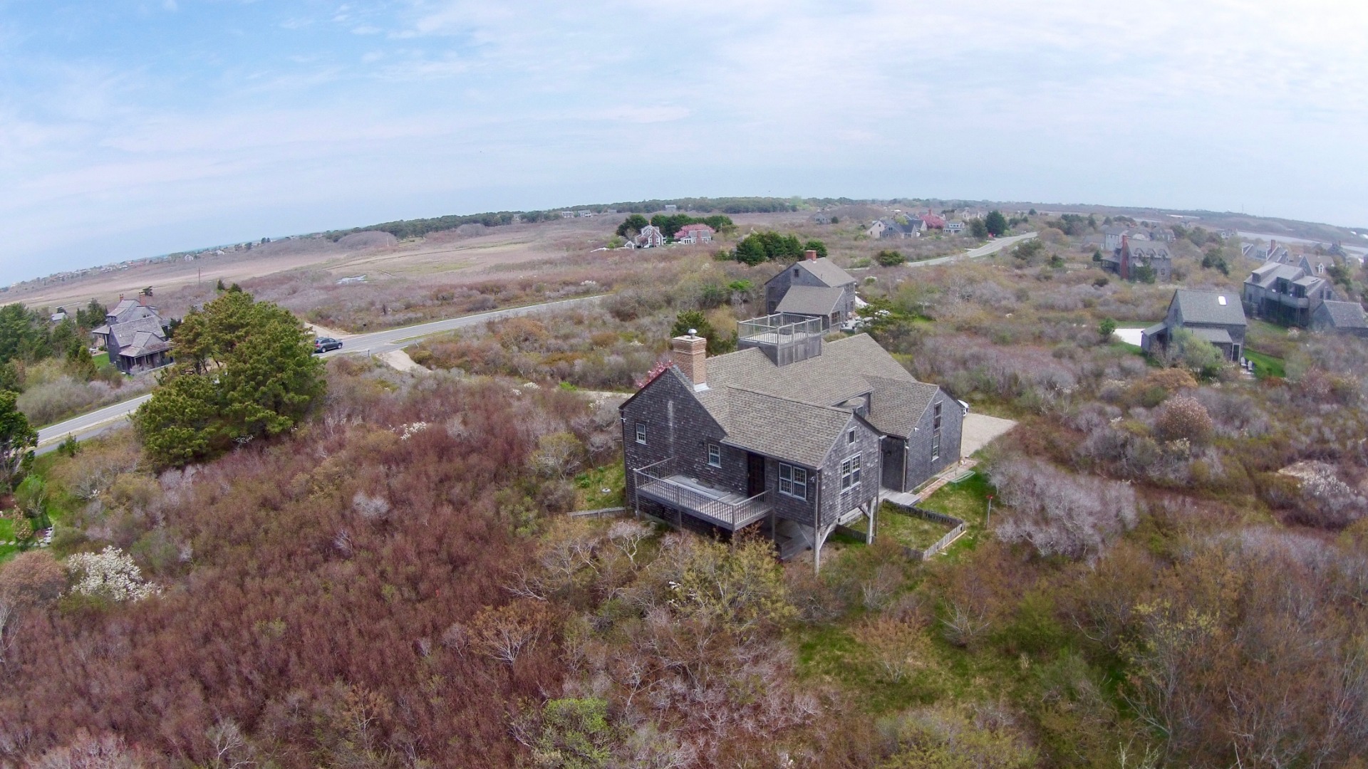 234 Madaket Road Nantucket, MA 02554 - Photo 9 of 50 set back from the Madaket Road, second floor deck off of the dining room to watch beautiful sunsets