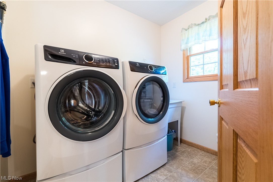 7055 Clark Road Atwater, OH 44201 - Photo 15 of 34 First floor laundry and utility room doubles as a half bathroom.