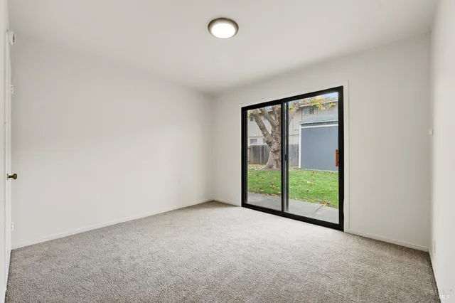 a view of an empty room with a sliding door