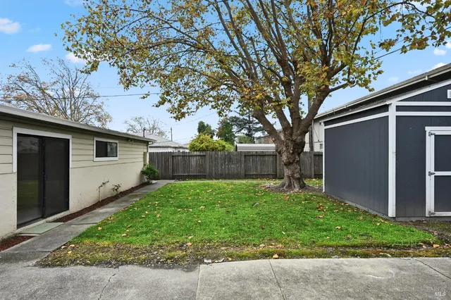 a view of a back yard of the house