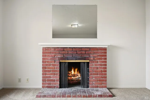 a living room with a fireplace