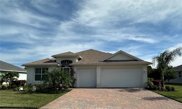 a front view of house with garden