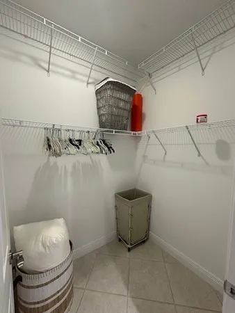 a view of a hallway to rooms