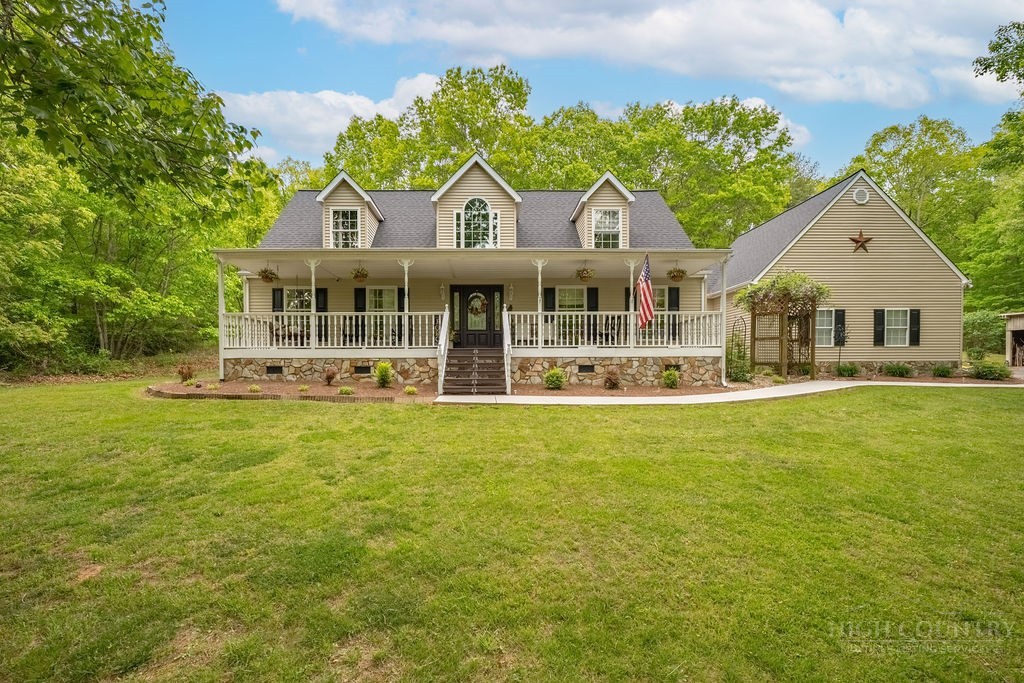 970 Vox Road Sparta, NC 28675 - Photo 4 of 50 a front view of houses with yard and green space