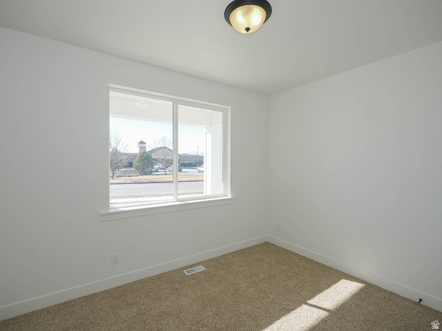 3938 North Wood Road Eagle Mountain, UT 84005 - Photo 24 of 55 Carpeted spare room with baseboards