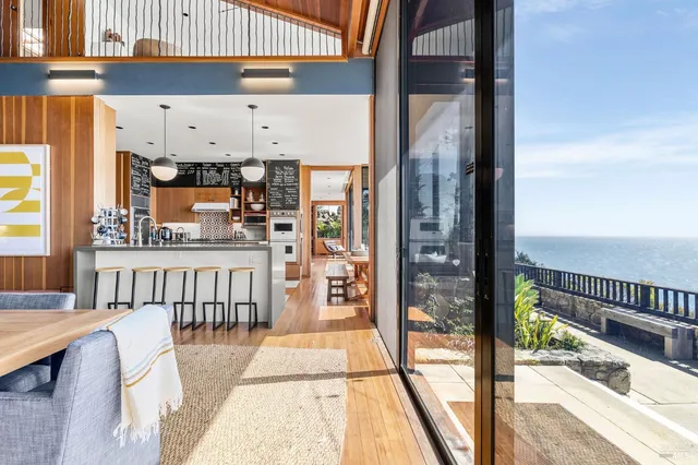 a view of a balcony with wooden floor