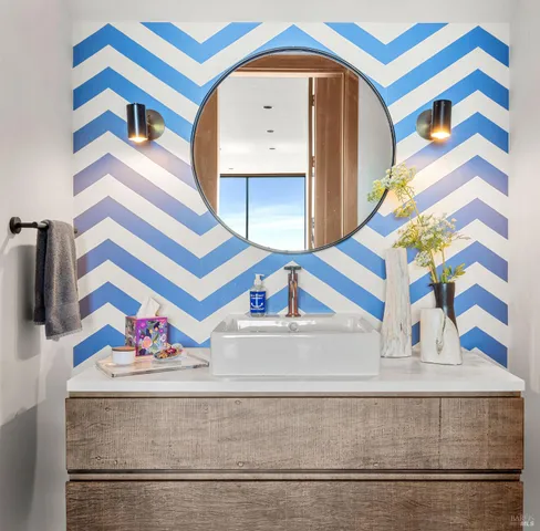 a view of staircase with a front door