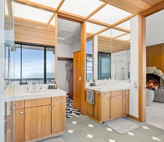 a bathroom with a sink vanity and a mirror