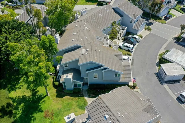 an aerial view of a house with a yard