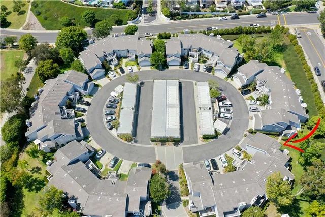 an aerial view of a house with a swimming pool outdoor seating and yard