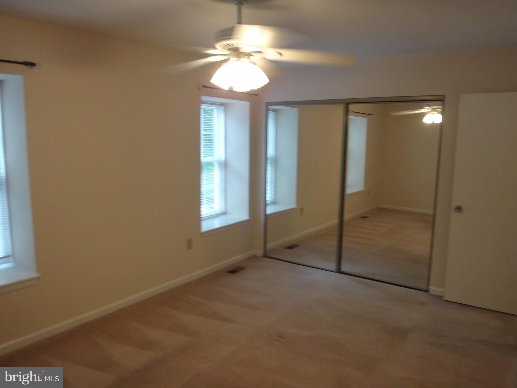 6446 Shannon Station Court Springfield, VA 22152 - Photo 12 of 25 an empty room with windows and closet