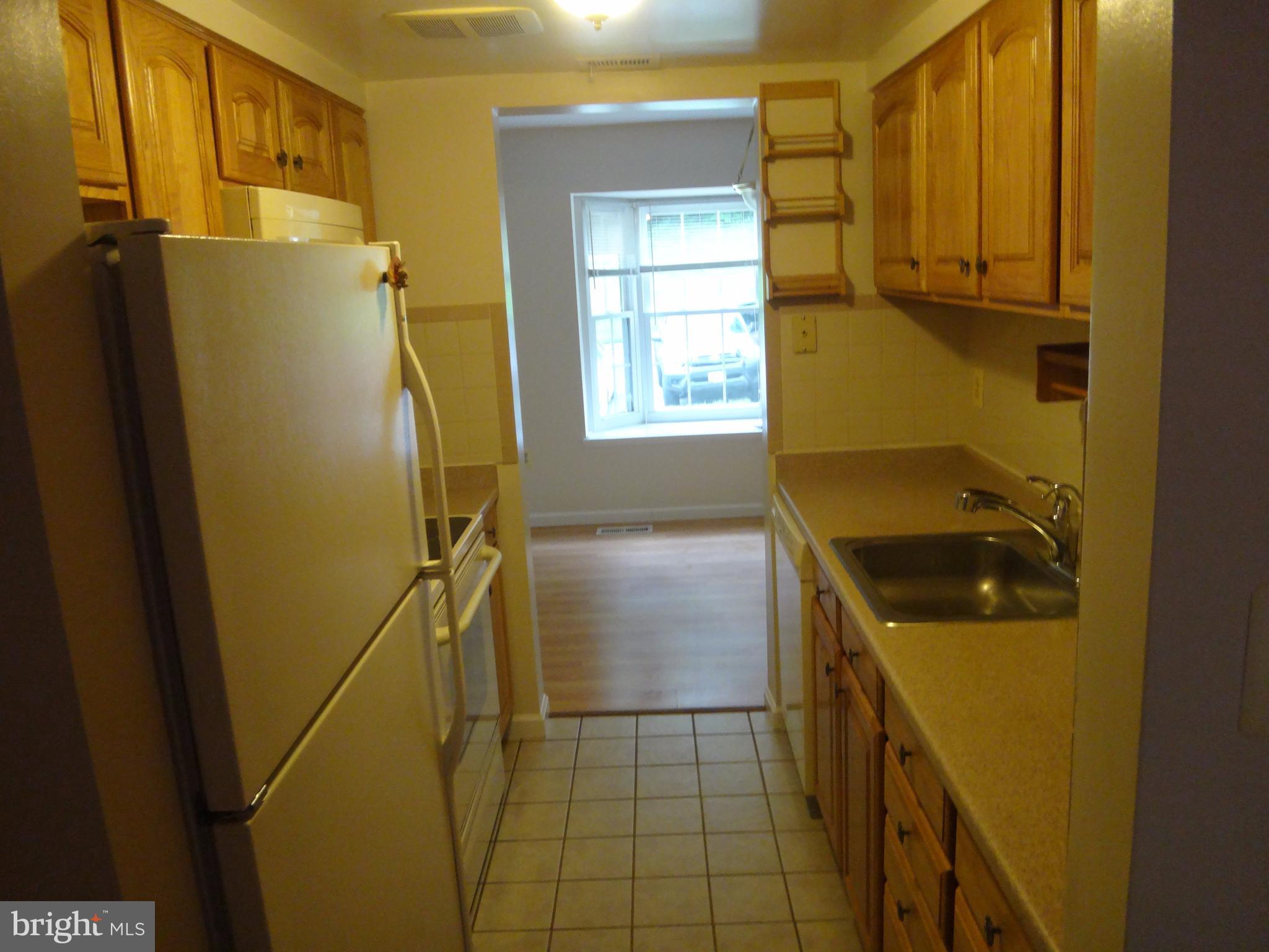 6446 Shannon Station Court Springfield, VA 22152 - Photo 3 of 25 a bathroom with a granite countertop shower and a sink