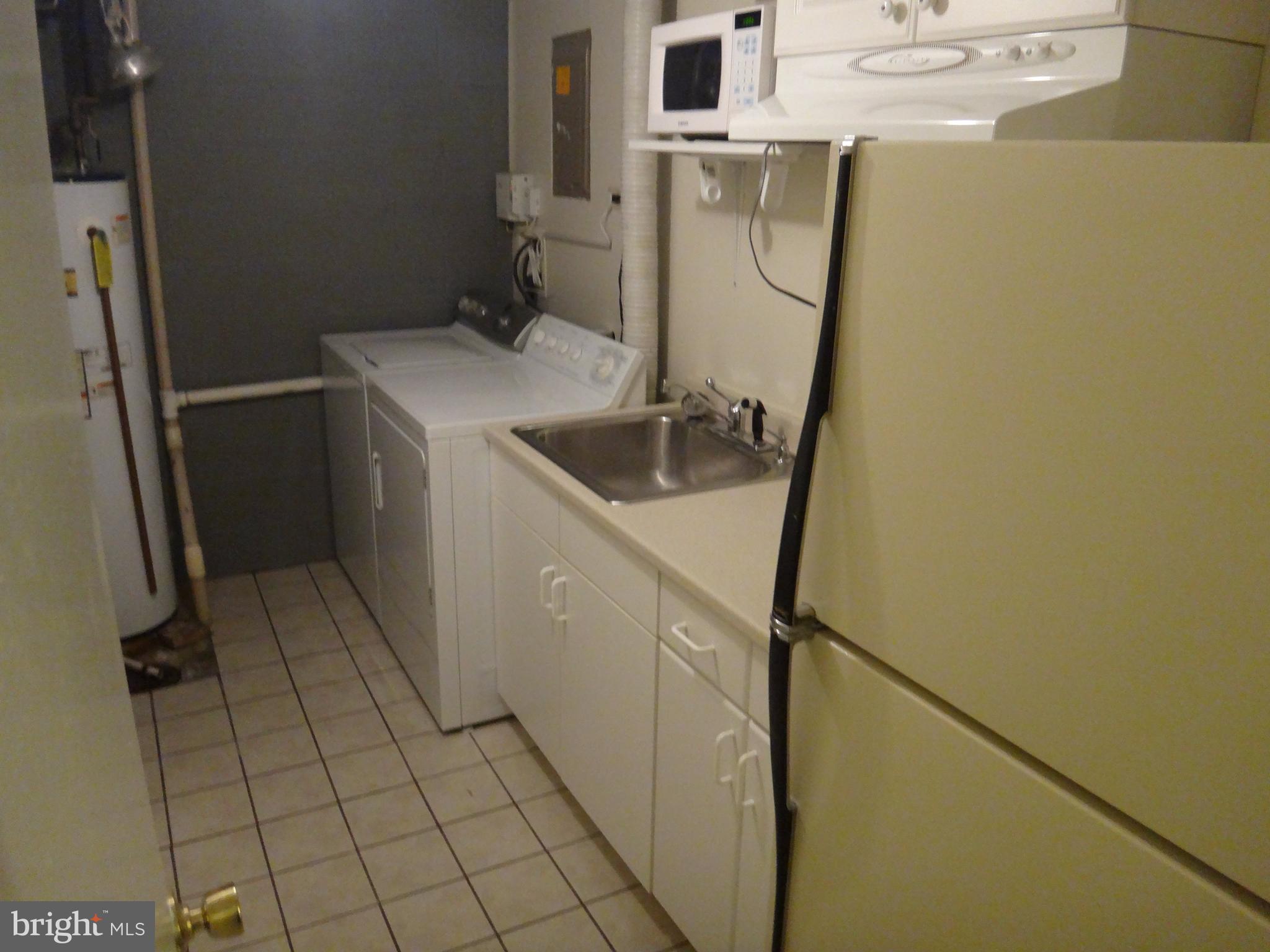 6446 Shannon Station Court Springfield, VA 22152 - Photo 21 of 25 a utility room with dryer and washer