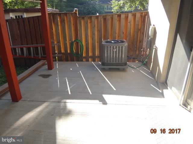 6446 Shannon Station Court Springfield, VA 22152 - Photo 23 of 25 a view of outdoor space with wooden fence