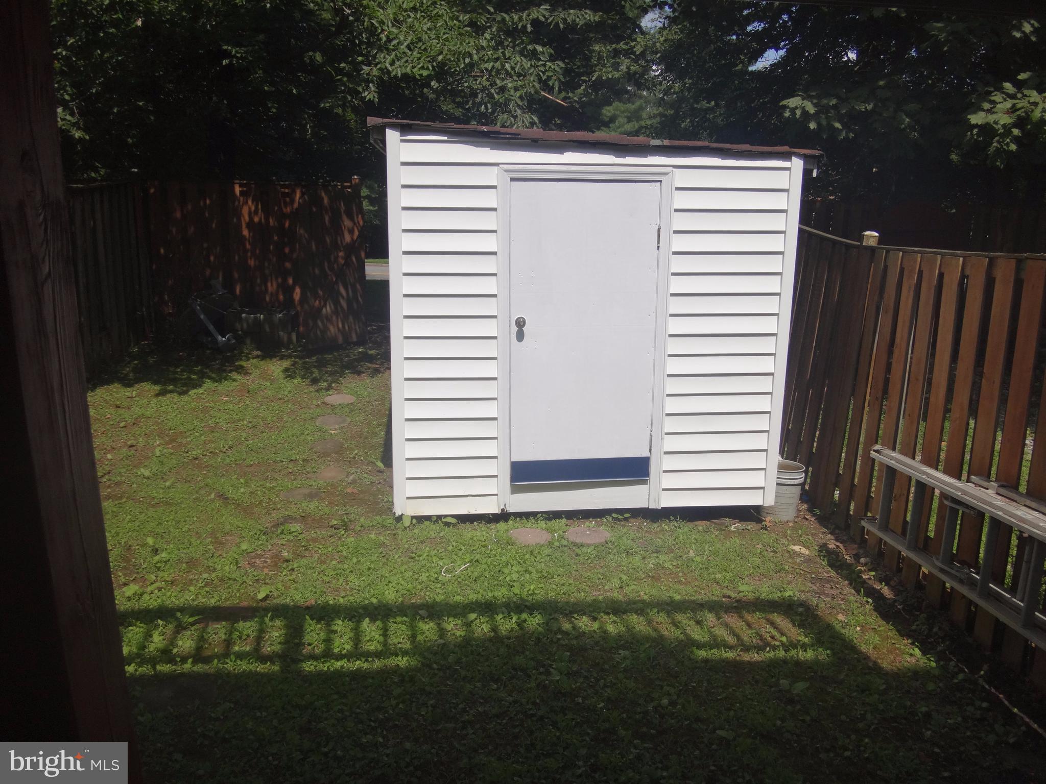 6446 Shannon Station Court Springfield, VA 22152 - Photo 24 of 25 a view of a house with backyard and deck