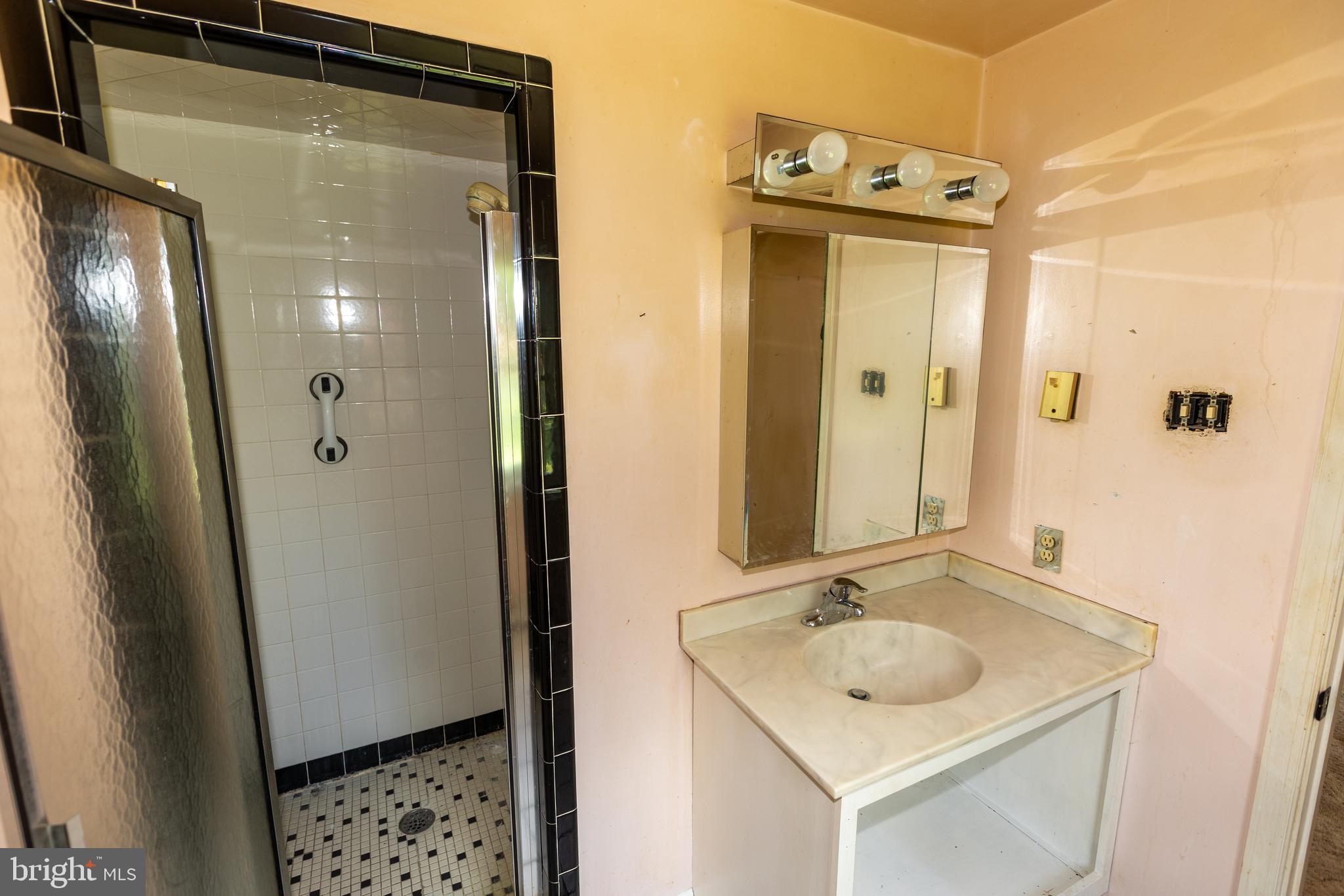 1929 Hillendale Road Chadds Ford, PA 19317 - Photo 38 of 56 a bathroom with a sink and mirror with toilet