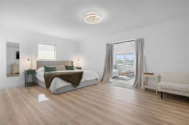 a bedroom with a bed and a table