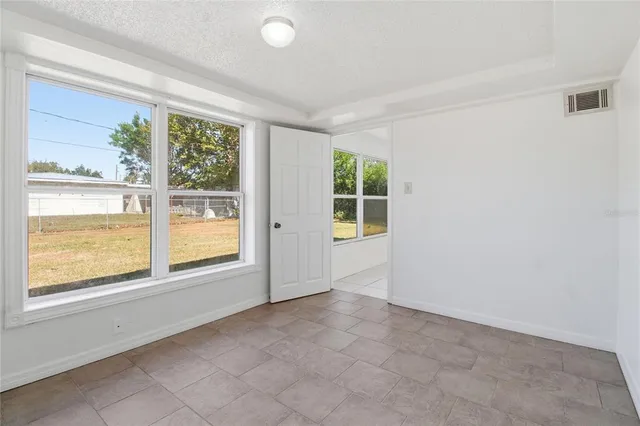 an empty room with windows