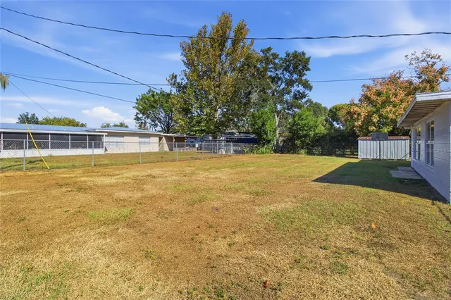 a view of a swimming pool with an outdoor space and seating area