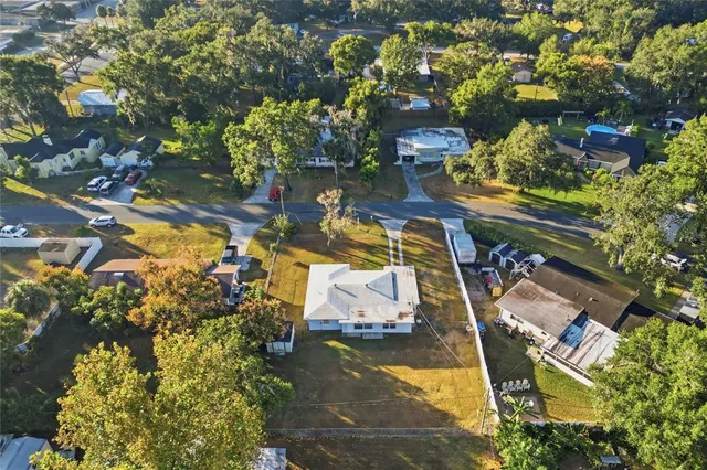 a view of swimming pool with sitting area