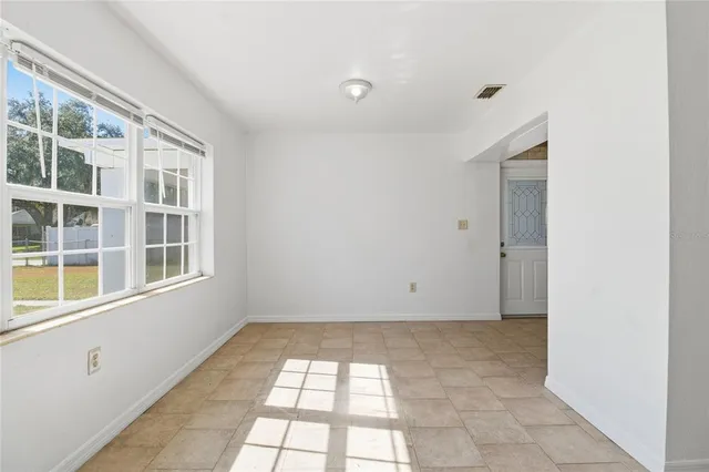a view of empty room with windows