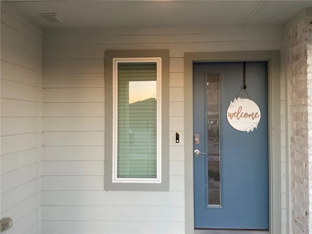 a view of a door and a window