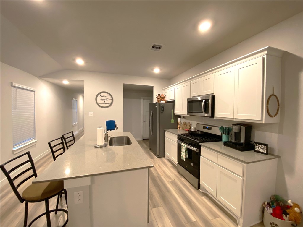 904 Kickapoo Lane College Station, TX 77845 - Photo 5 of 16 Kitchen with Quartz Island