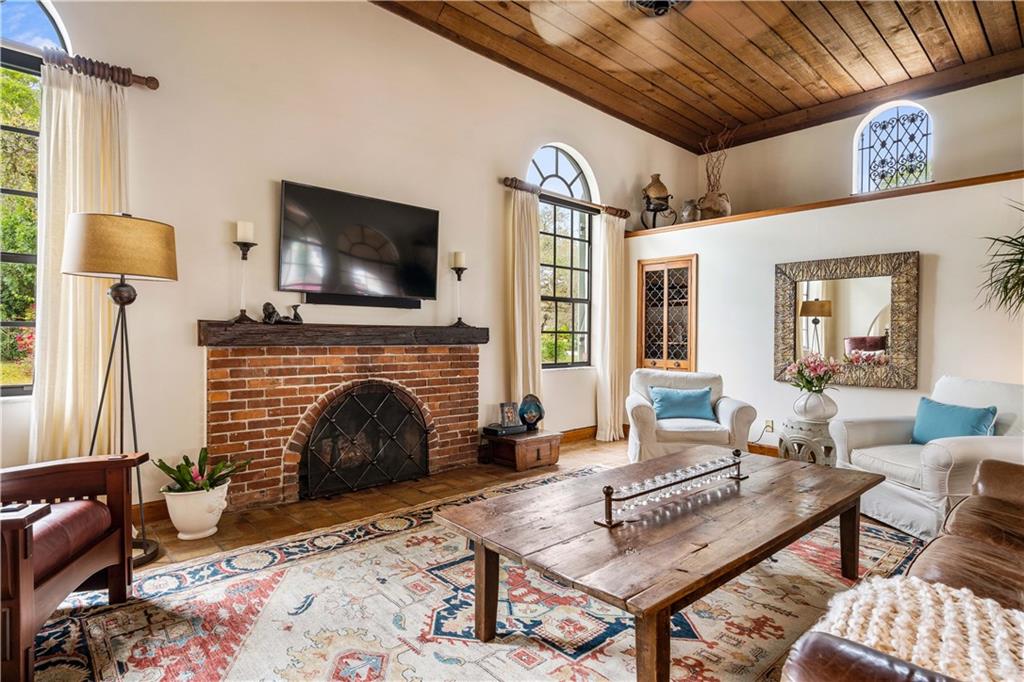 246 Live Oak Road Vero Beach, FL 32963 - Photo 11 of 30 a living room with furniture and a fireplace