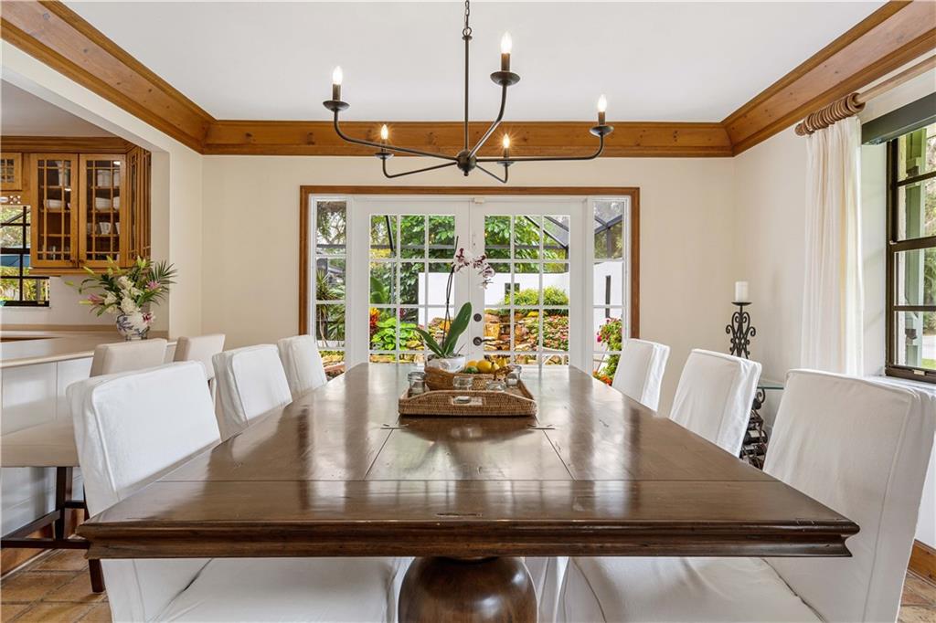 246 Live Oak Road Vero Beach, FL 32963 - Photo 13 of 30 a view of a dining room with furniture window and outside view