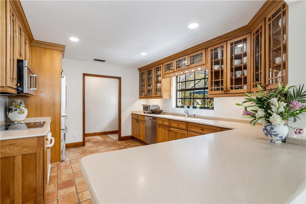 246 Live Oak Road Vero Beach, FL 32963 - Photo 14 of 30 a large swimming pool with a large window and chair