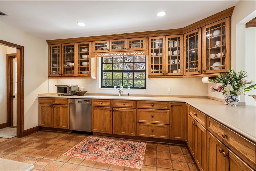 246 Live Oak Road Vero Beach, FL 32963 - Photo 15 of 30 a kitchen with a refrigerator and sink