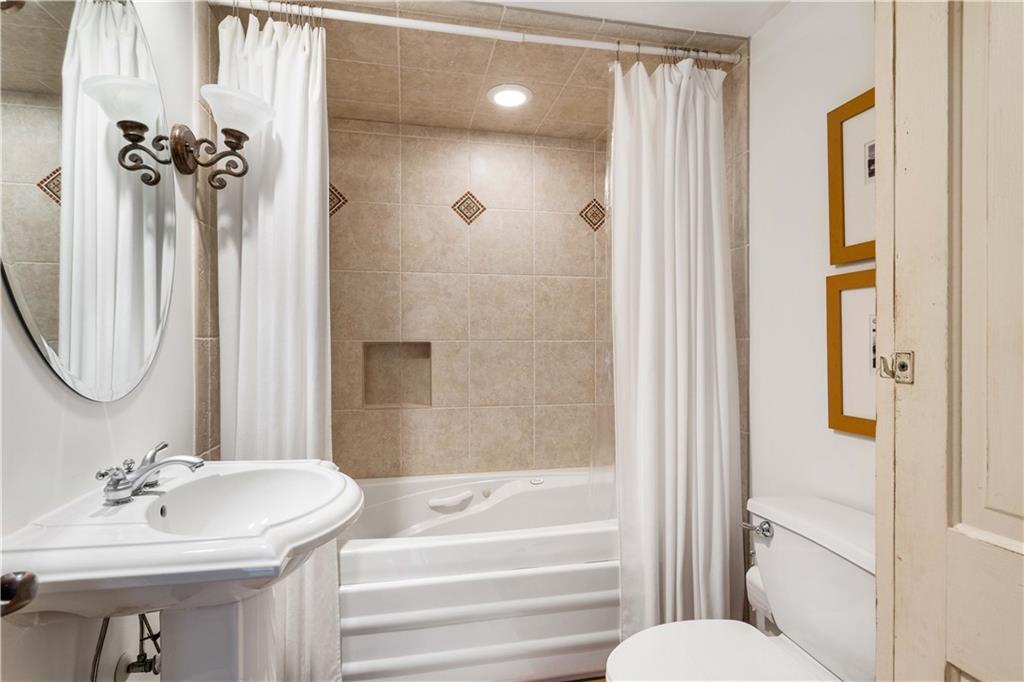 246 Live Oak Road Vero Beach, FL 32963 - Photo 21 of 30 a bathroom with a sink a toilet and shower