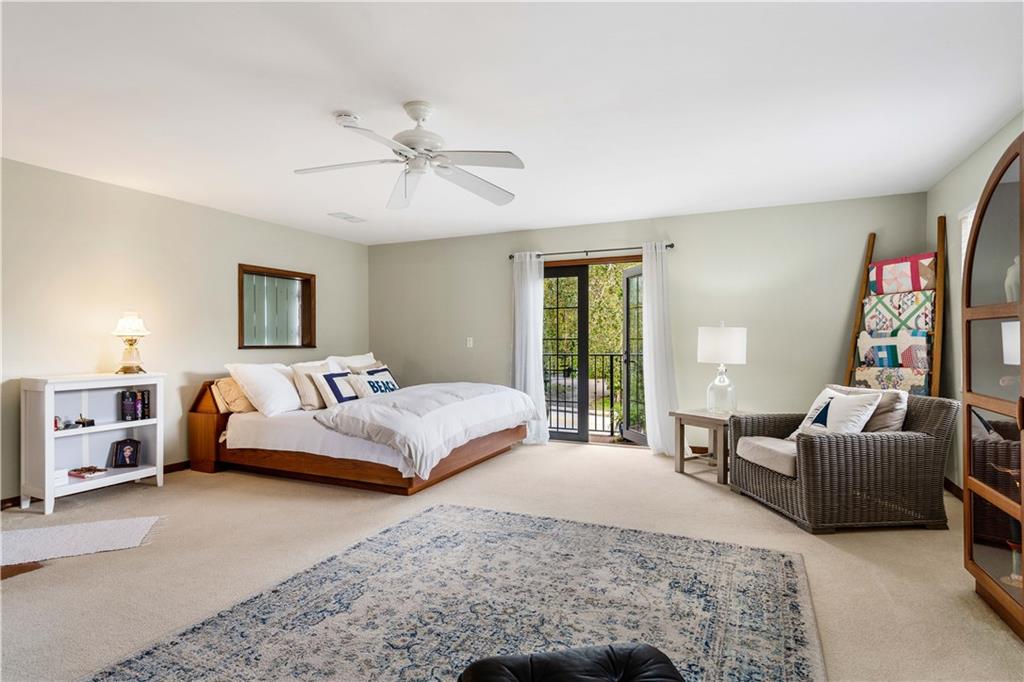 246 Live Oak Road Vero Beach, FL 32963 - Photo 24 of 30 a bedroom with a bed couch and a window