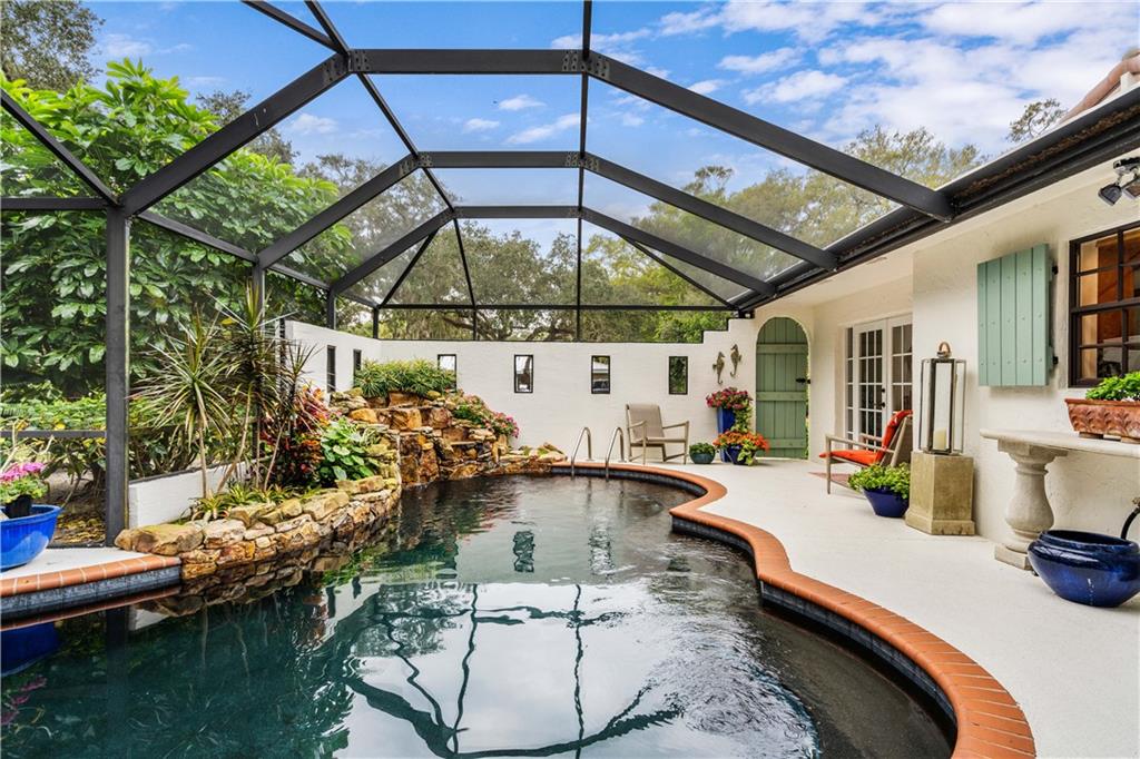 246 Live Oak Road Vero Beach, FL 32963 - Photo 30 of 30 a view of a swimming pool with a patio