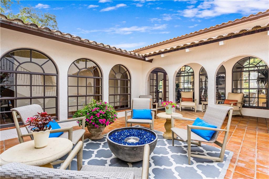 246 Live Oak Road Vero Beach, FL 32963 - Photo 3 of 30 a view of a swimming pool with outdoor seating