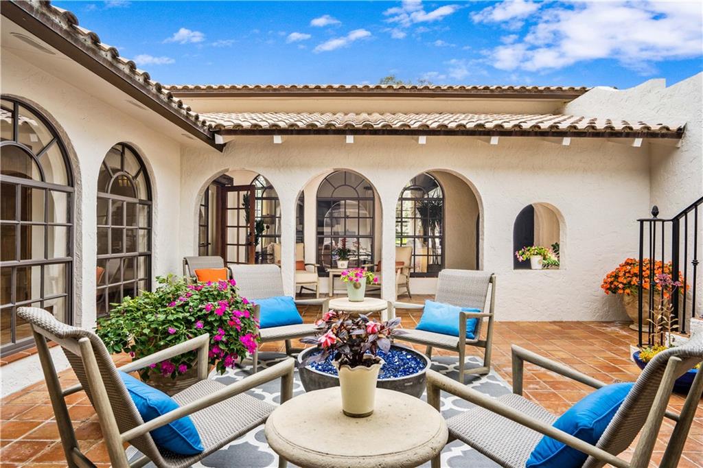 246 Live Oak Road Vero Beach, FL 32963 - Photo 4 of 30 a view of a dining room with furniture and a potted plant