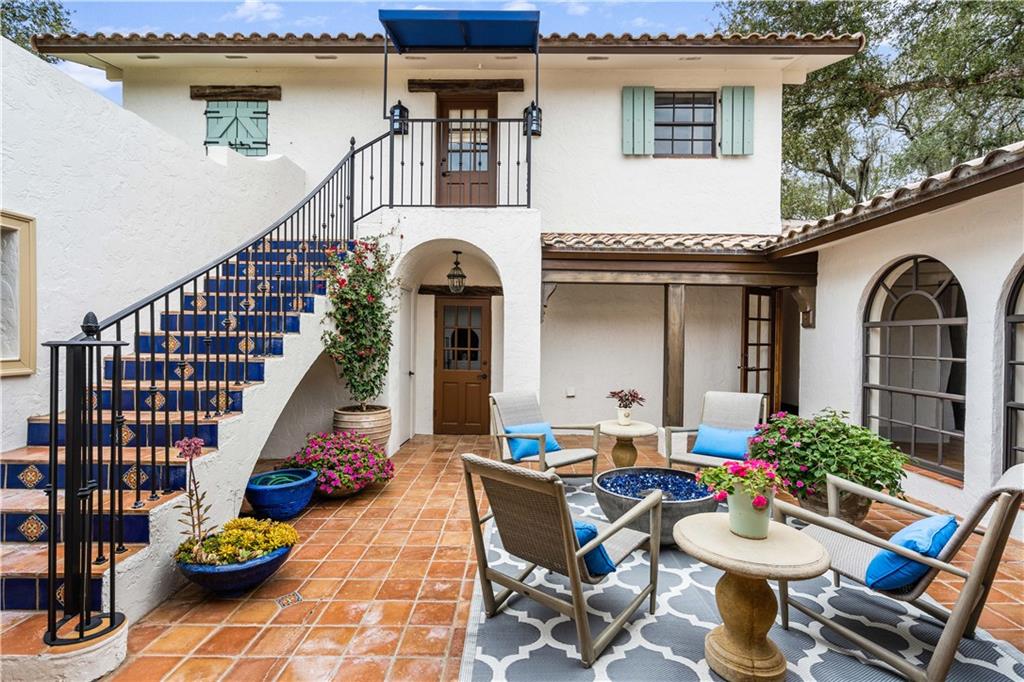 246 Live Oak Road Vero Beach, FL 32963 - Photo 6 of 30 a front view of house with outdoor seating space